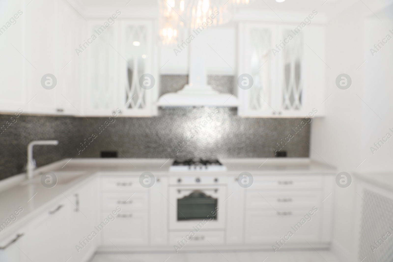 Photo of Blurred view of beautiful kitchen interior with new stylish furniture