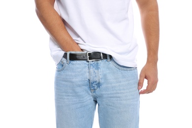 Photo of Man scratching crotch on white background, closeup. Annoying itch