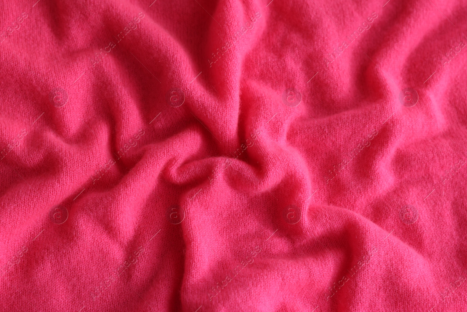 Photo of Beautiful pink fabric as background, top view