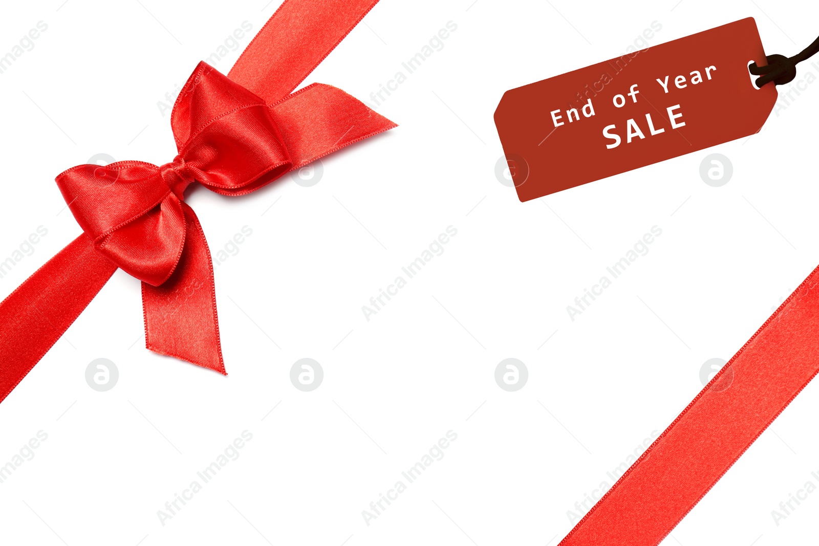 Image of Boxing day. Tag with text End Of Year Sale attached to gift, closeup