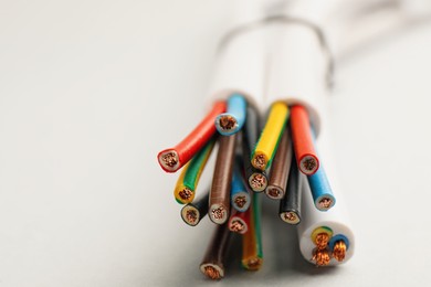 Cables with wires on light background, closeup