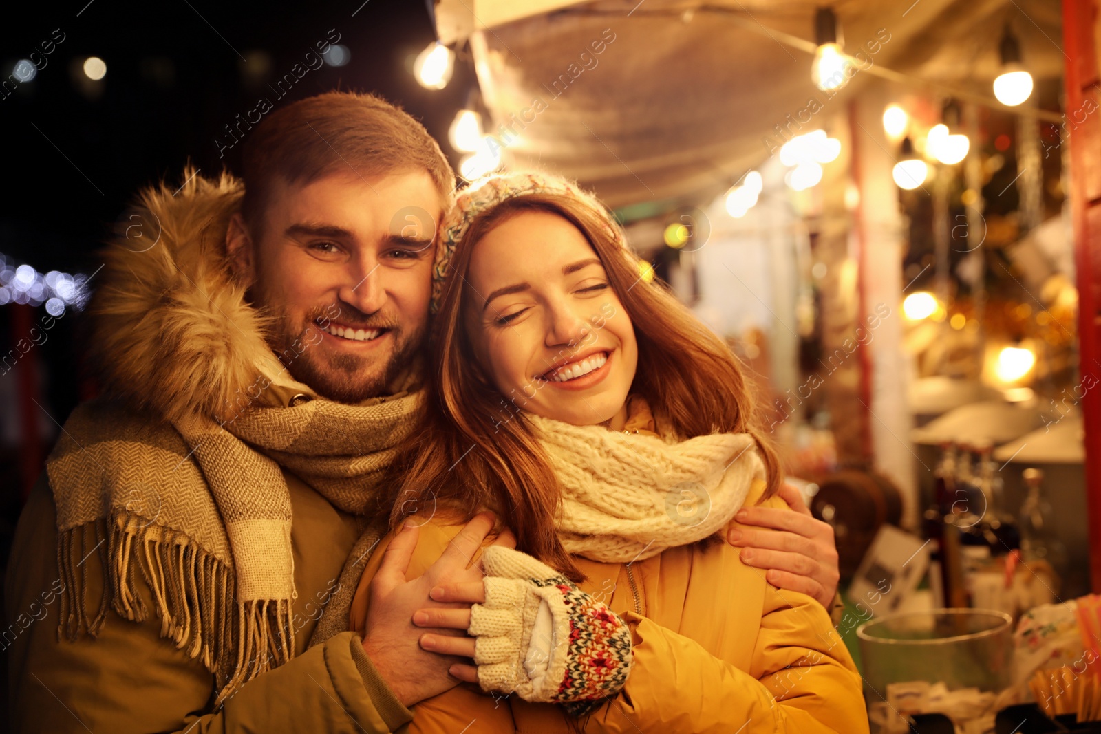 Photo of Happy couple spending time at Christmas fair