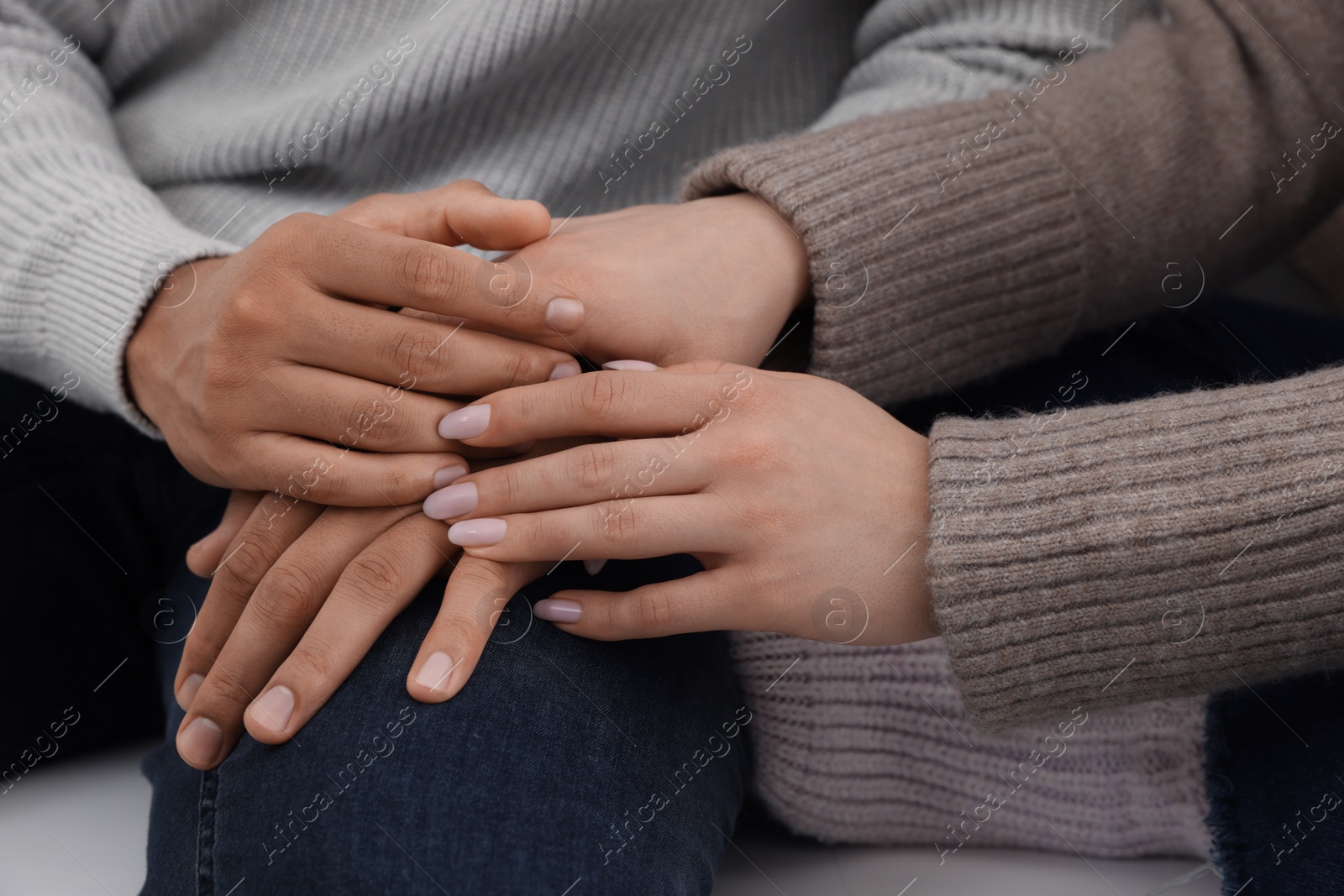 Photo of Dating agency. Couple holding hands together, closeup view