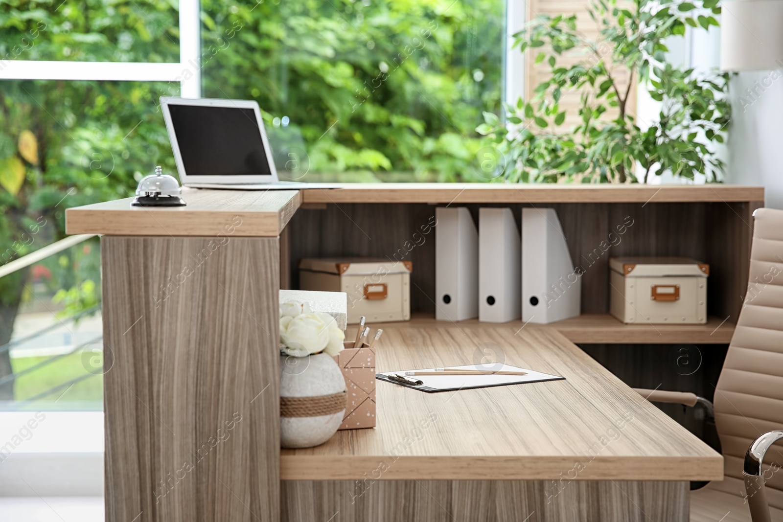 Photo of Receptionist desk in hotel. Workplace interior