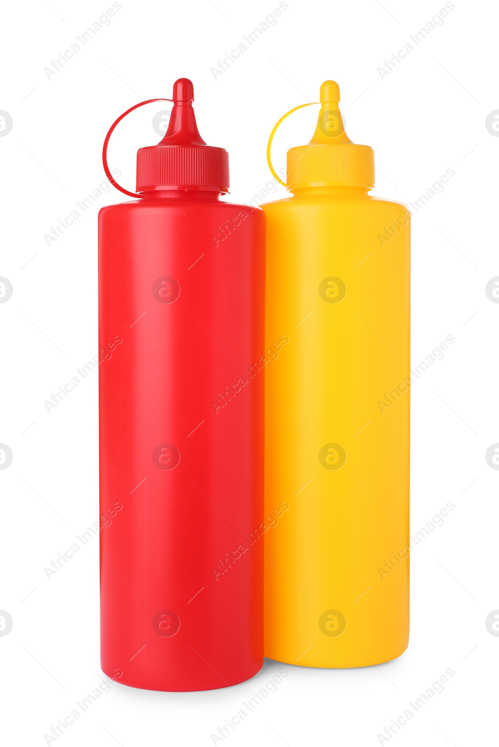 Photo of Plastic bottles of tasty ketchup and mustard on white background