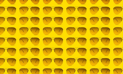 Many stylish sunglasses on yellow background. Seamless pattern design