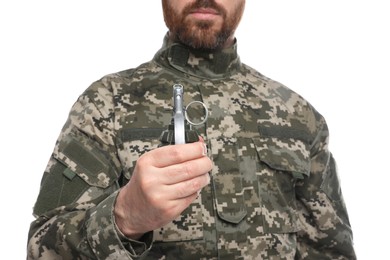 Photo of Soldier holding hand grenade on white background, closeup. Military service