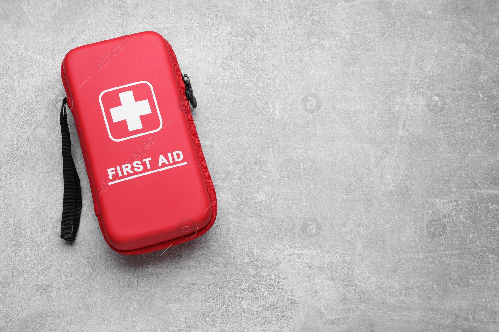 Photo of Medicine bag on light gray background, top view with space for text. First aid kit