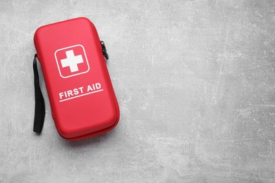 Photo of Medicine bag on light gray background, top view with space for text. First aid kit