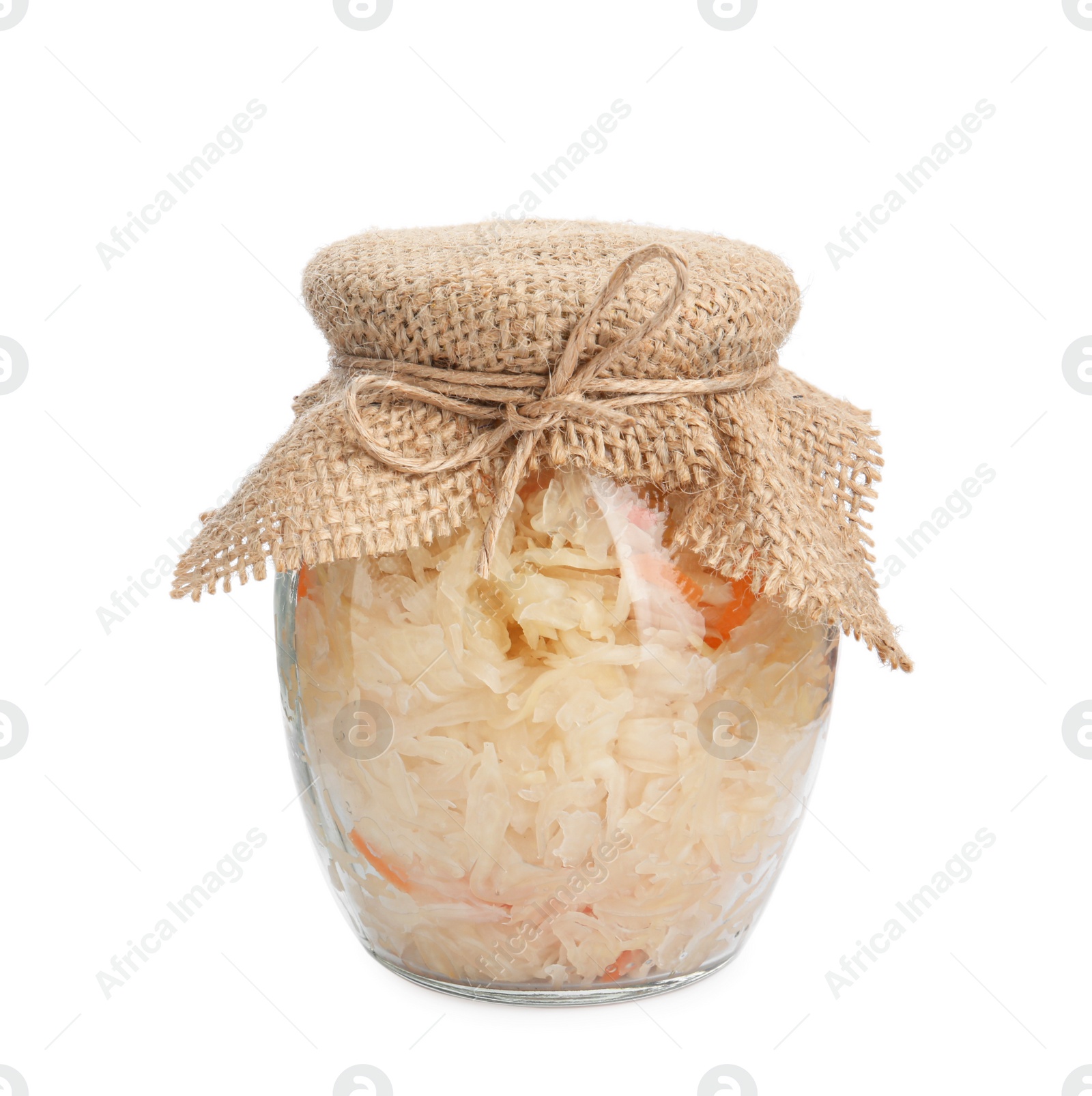 Photo of Glass jar of tasty fermented cabbage with carrot on white background