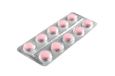 Blister of pink pills on white background