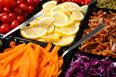 Salad bar with different fresh ingredients as background, closeup