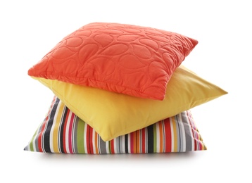 Photo of Stack of different colorful pillows on white background