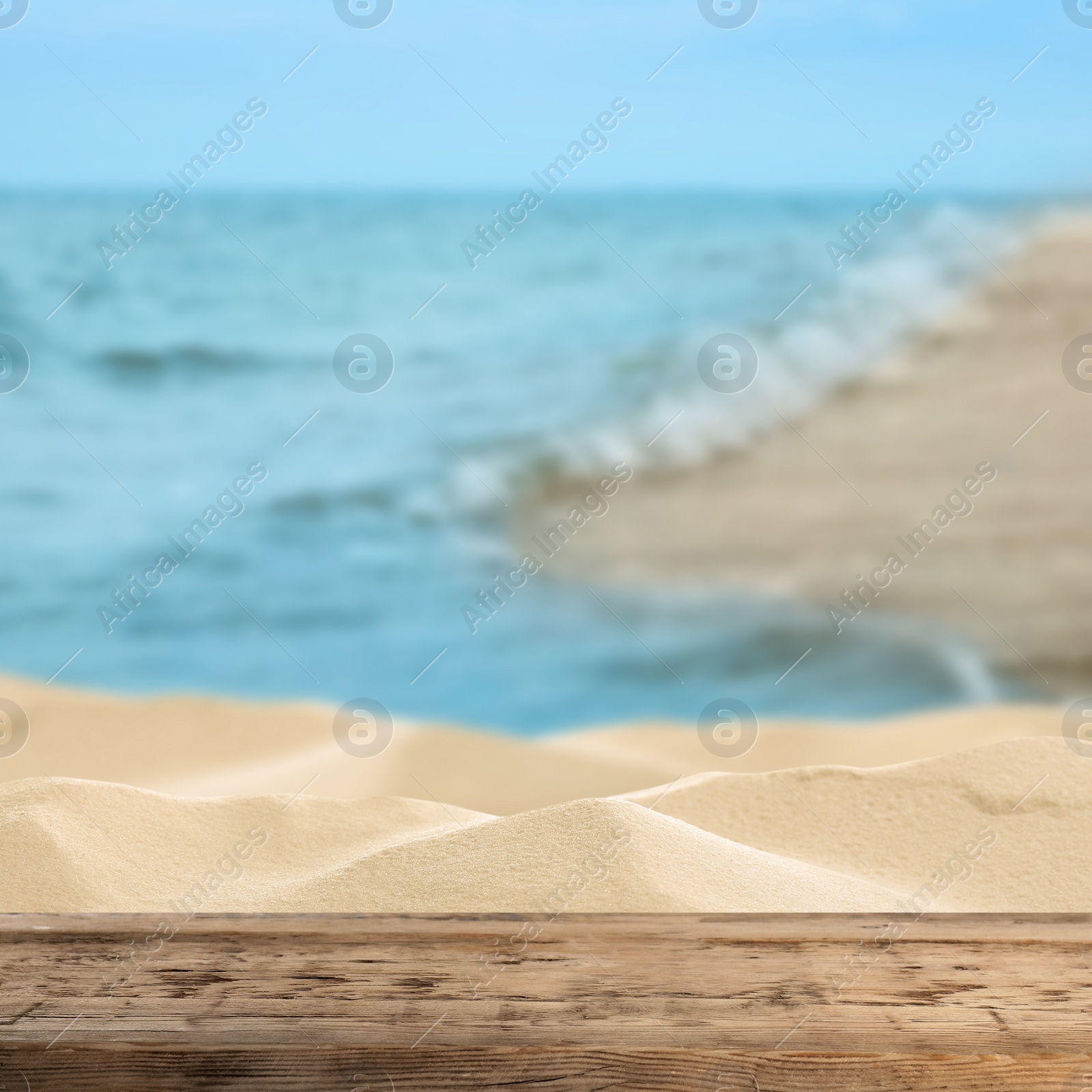 Image of Wooden surface on sandy beach near ocean