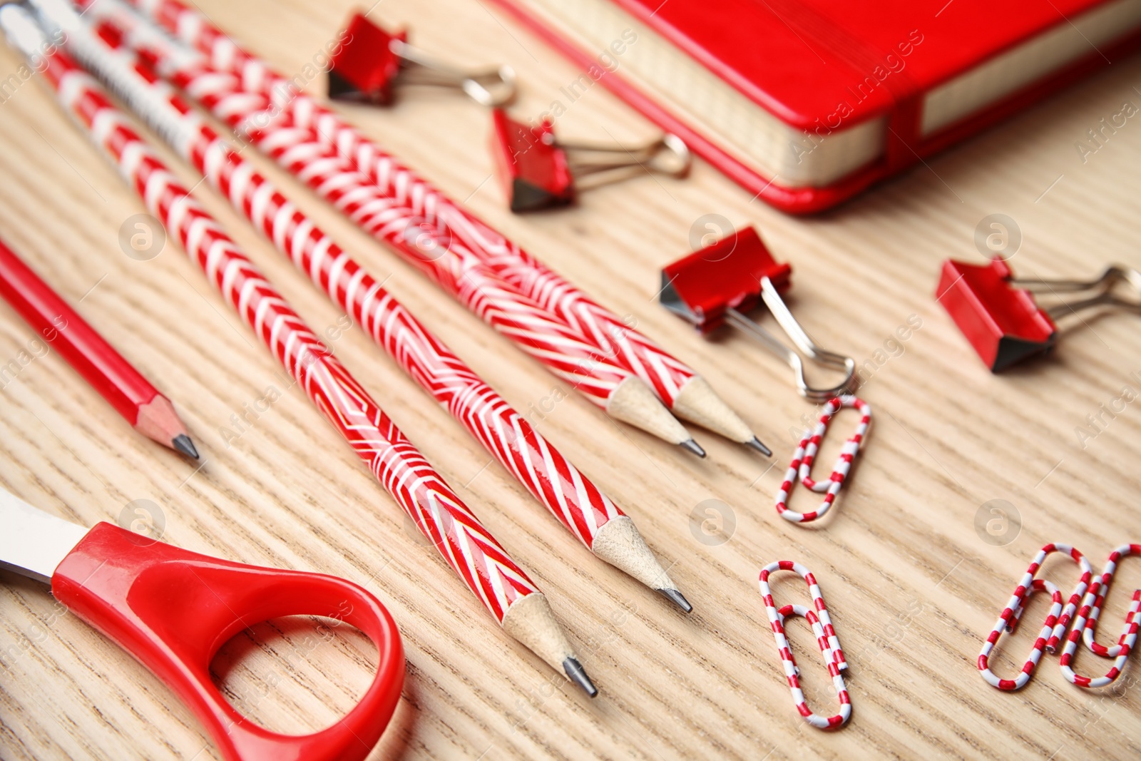 Photo of Different stationery on wooden table. Back to school