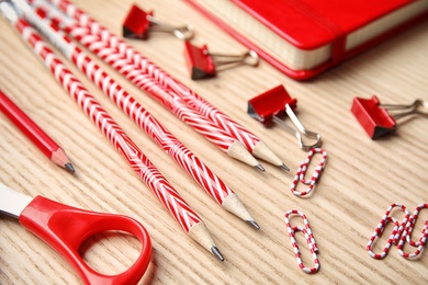 Photo of Different stationery on wooden table. Back to school