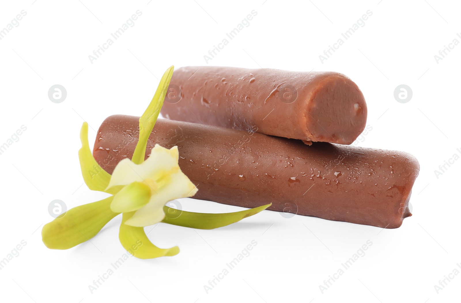 Photo of Glazed curd cheese bars and vanilla flower isolated on white