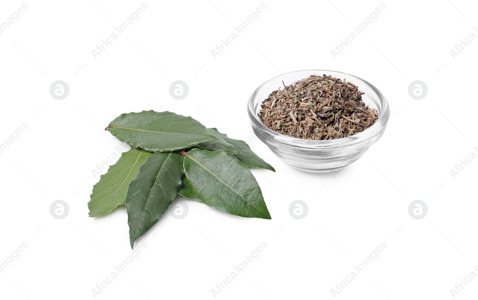 Photo of Bowl with different spices and fresh bay leaves on white background