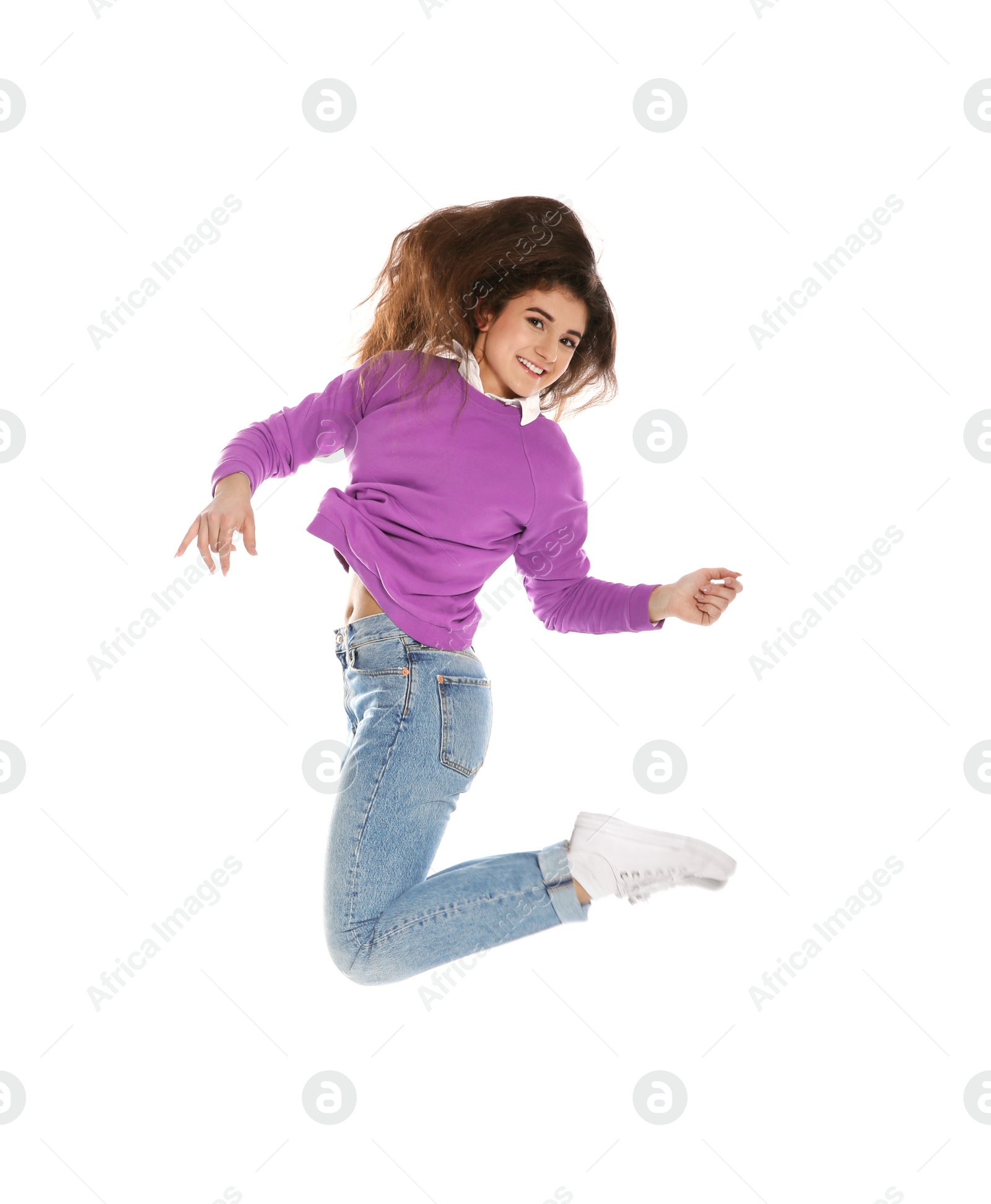 Photo of Beautiful young woman in stylish clothes jumping on white background