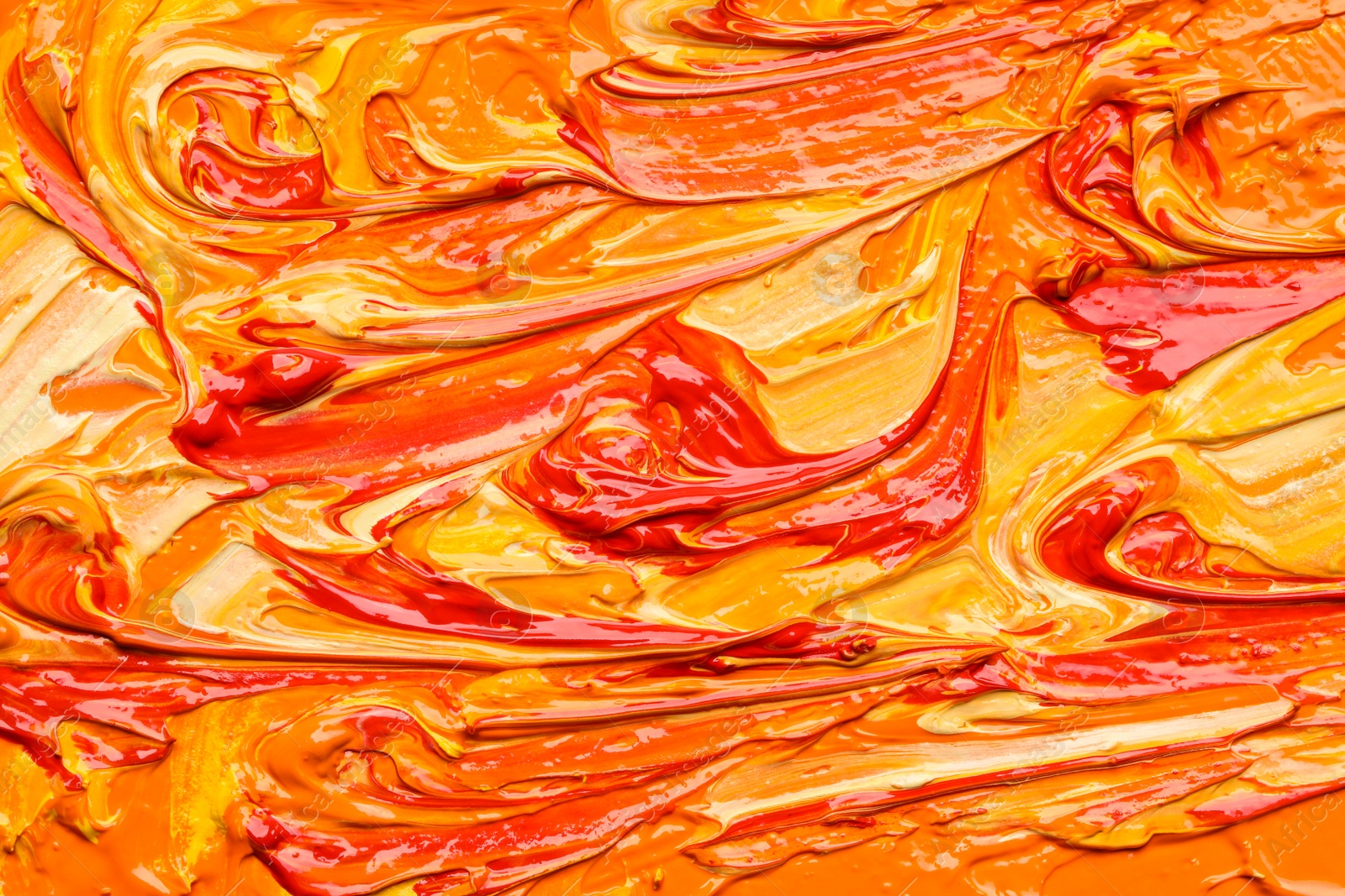 Photo of Beautiful strokes of colorful oil paints as background, closeup