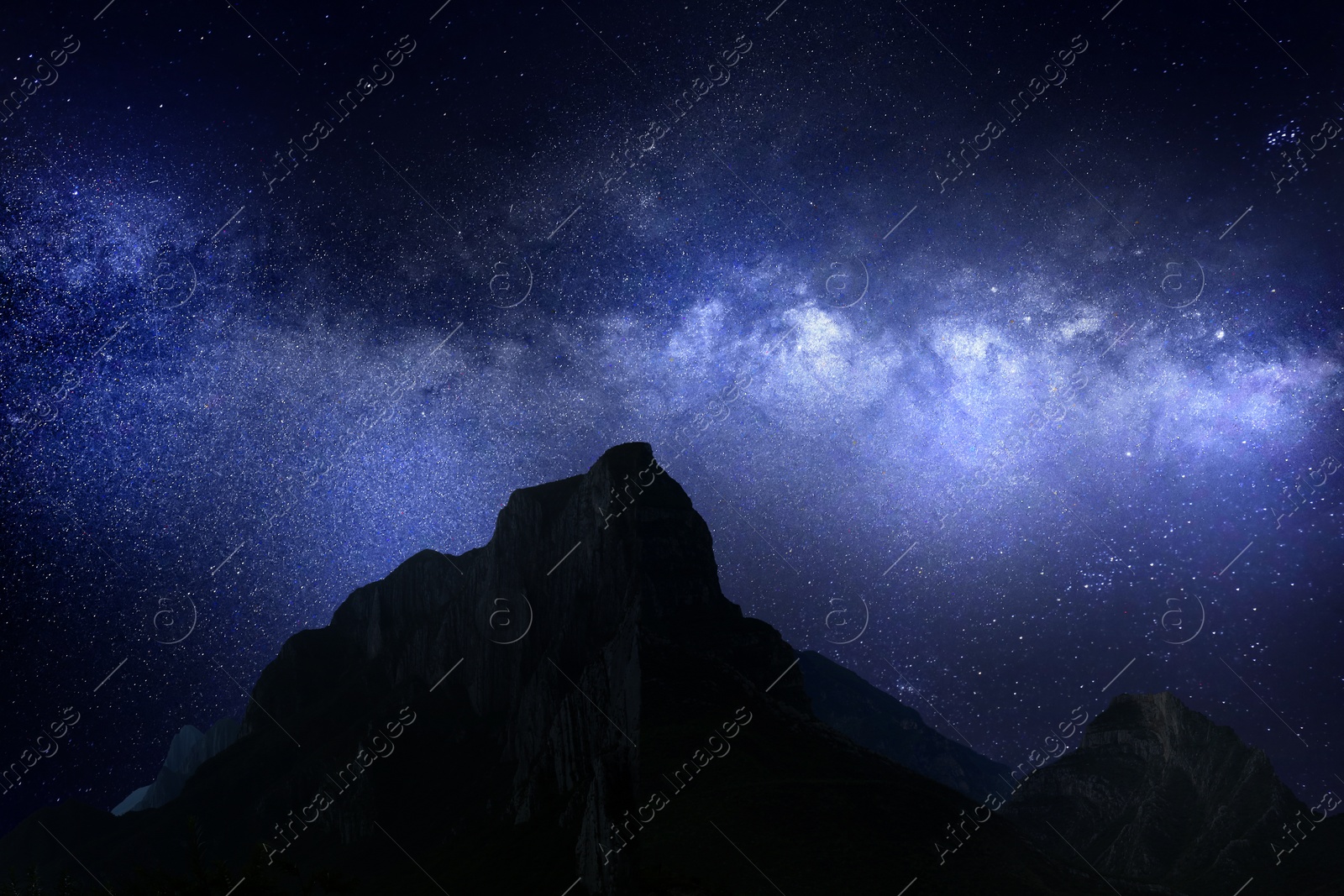 Image of Picturesque view of starry sky over mountains at night