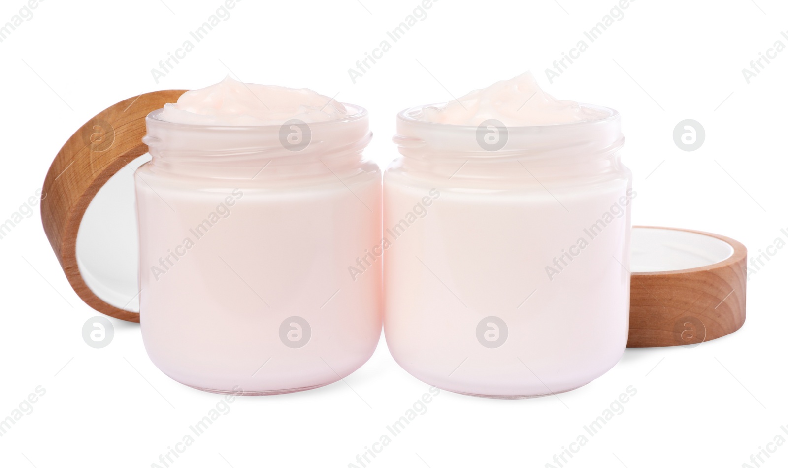 Photo of Jars of face cream isolated on white