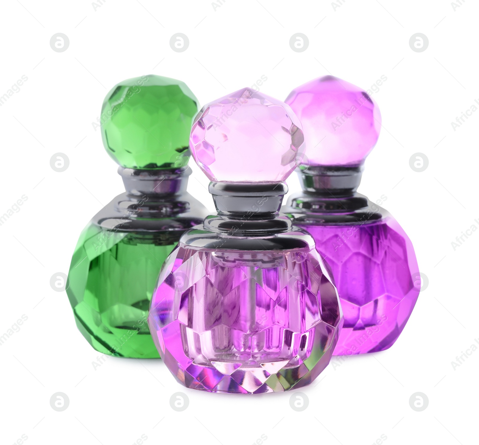 Photo of Bottles of luxury perfume isolated on white