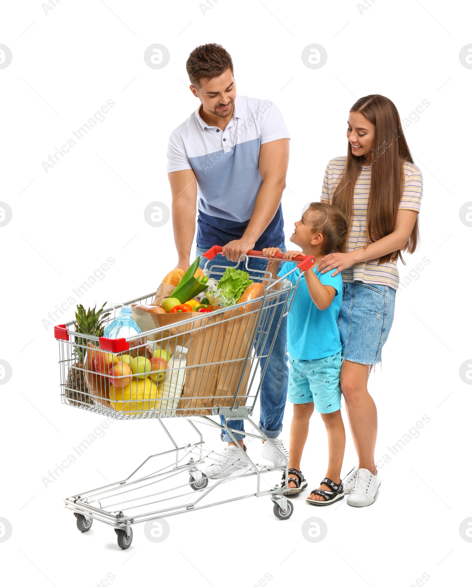 Photo of Happy family with full shopping cart on white background