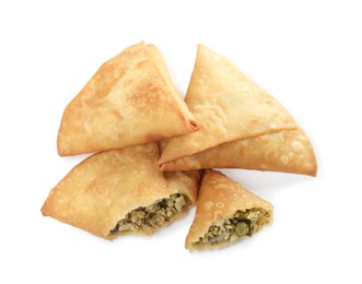 Photo of Fresh whole and cut samosas on white background, top view