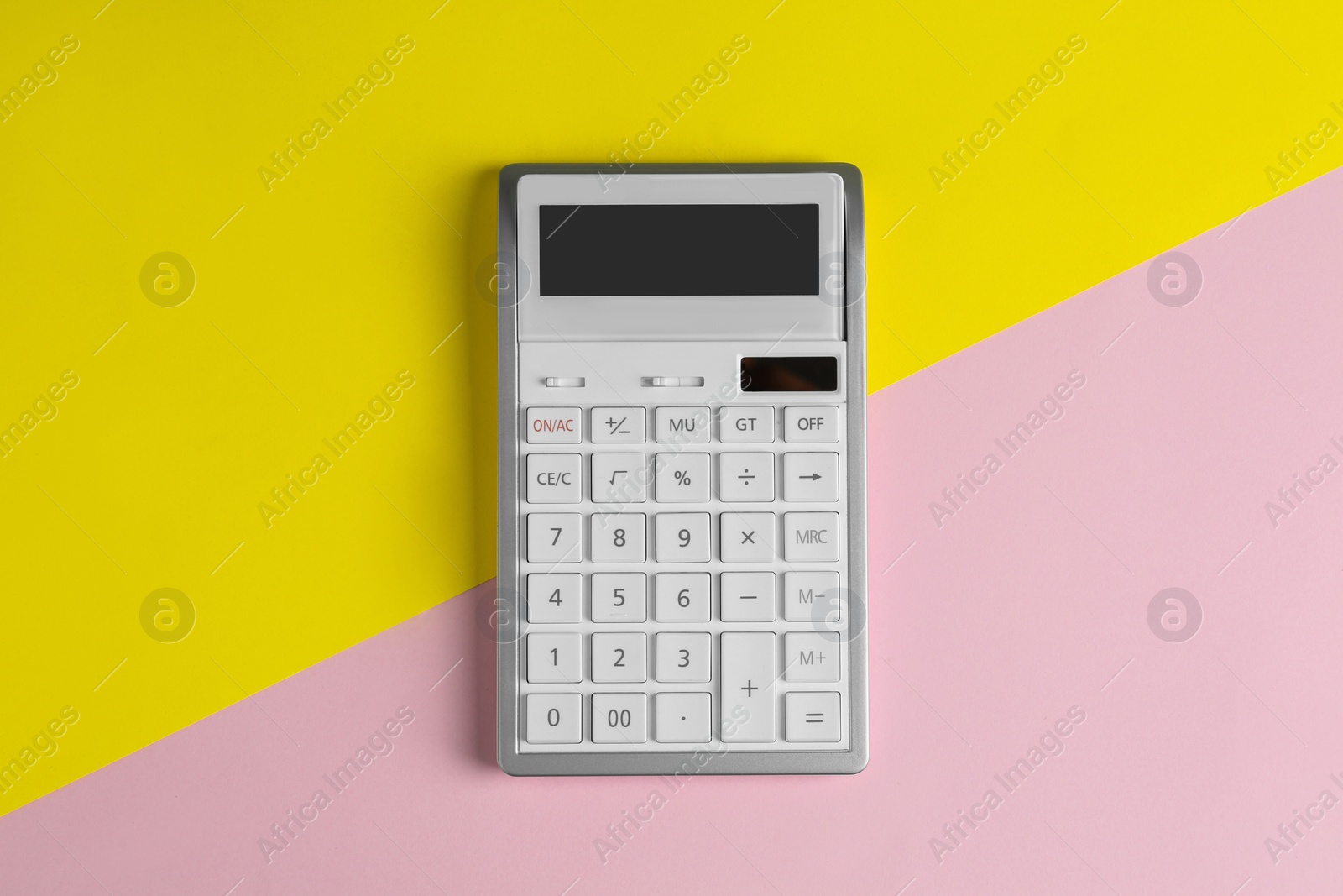 Photo of Modern calculator on color background, top view