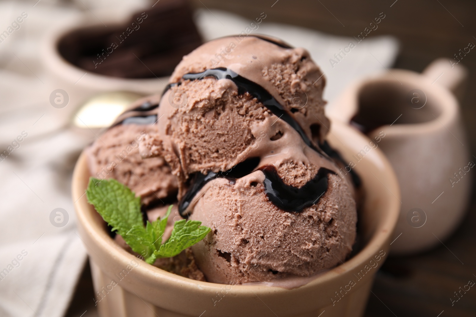 Photo of Bowl of tasty chocolate ice cream, closeup