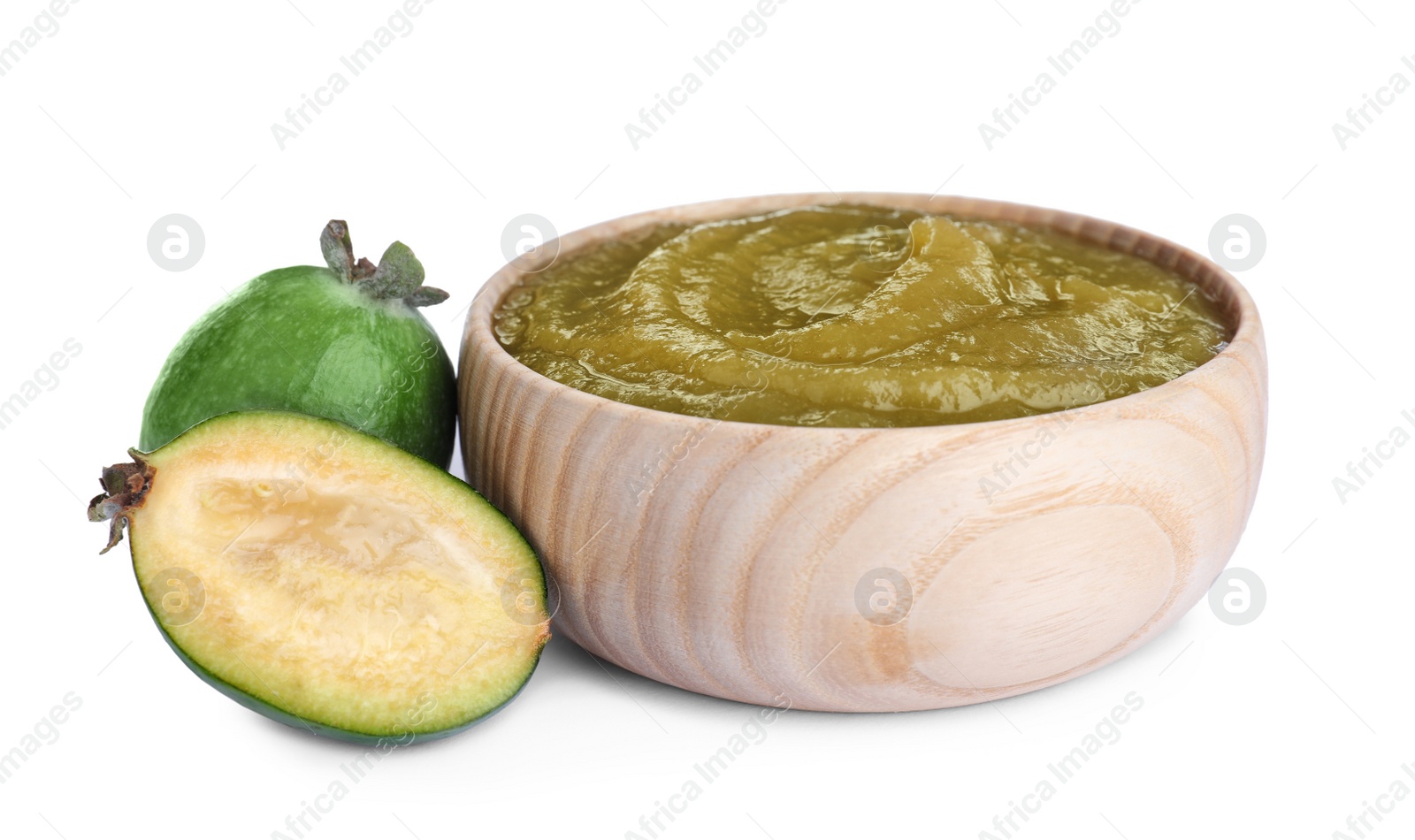 Photo of Feijoa jam in wooden bowl and fresh fruits on white background