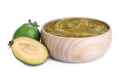 Photo of Feijoa jam in wooden bowl and fresh fruits on white background