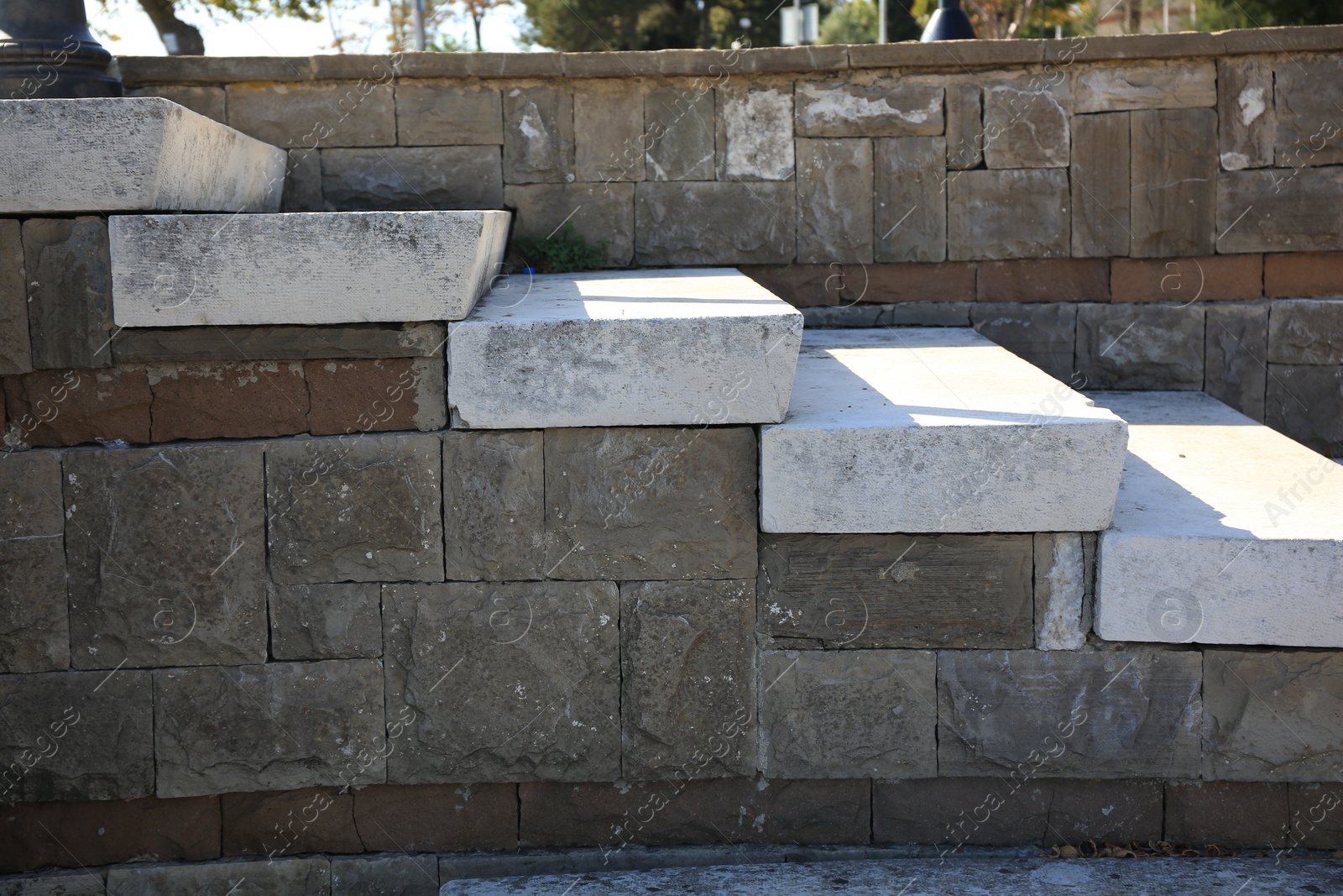 Photo of View of empty old concrete staircase outdoors on sunny day