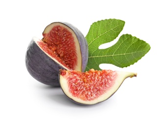 Cut purple fig with leaf on white background