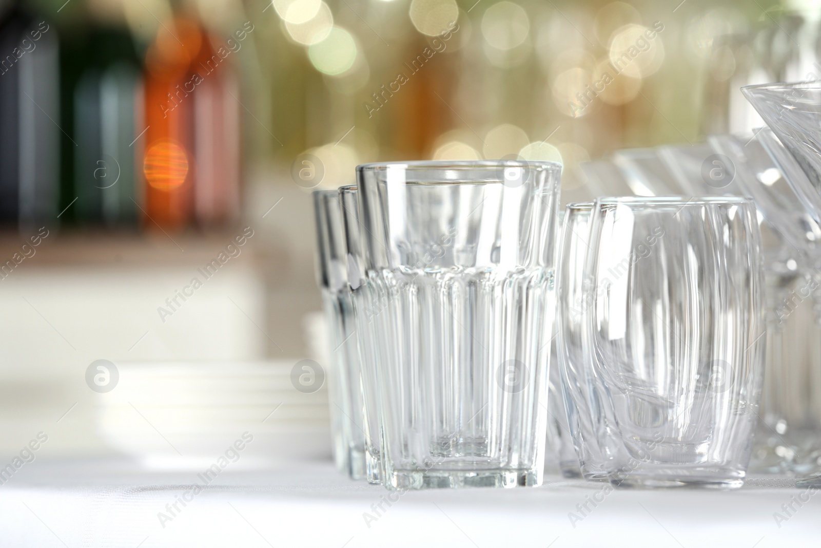 Photo of Set of empty glasses on table indoors