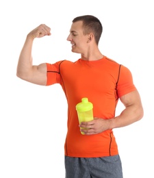 Photo of Athletic young man with protein shake on white background