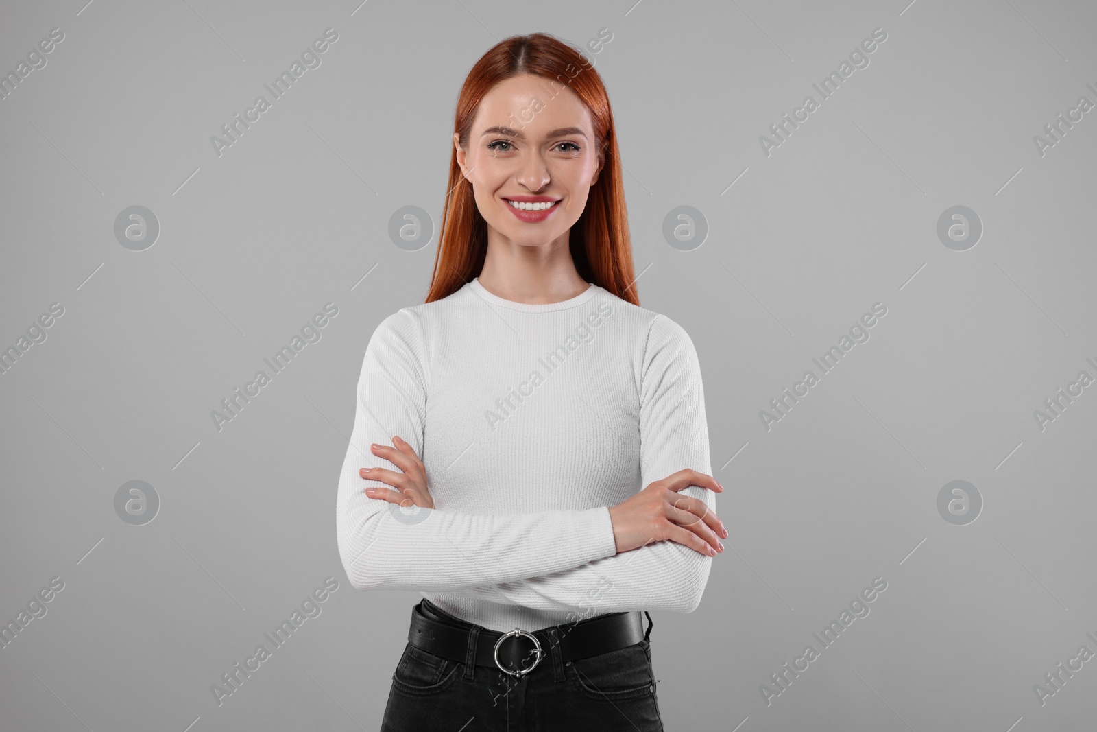 Photo of Portrait of beautiful young woman on light gray background