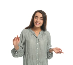 Photo of Young woman in casual clothes talking on white background