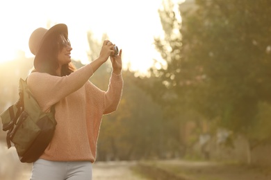 Traveler with photo camera on city street