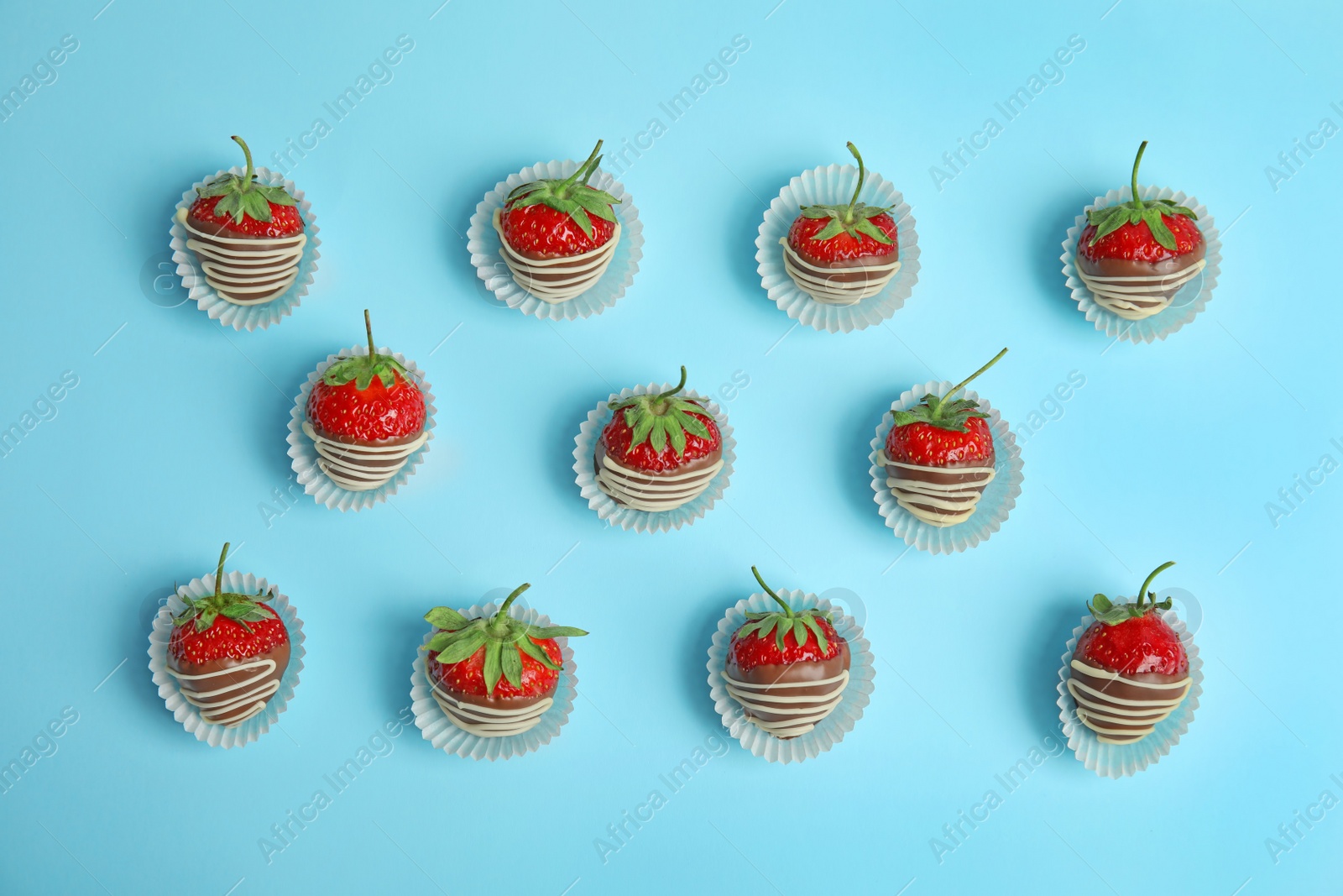 Photo of Flat lay composition with chocolate covered strawberries on color background