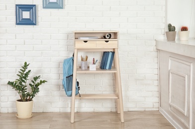 High wooden table as stand up workplace in modern interior