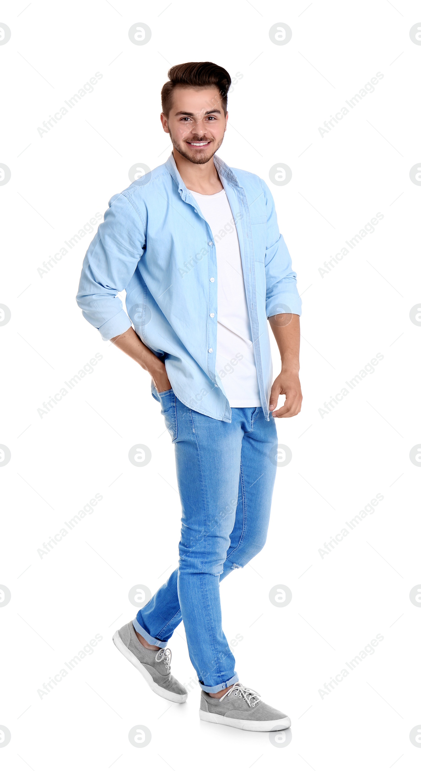 Photo of Young man in stylish jeans on white background