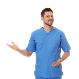 Photo of Portrait of smiling male doctor in scrubs isolated on white. Medical staff