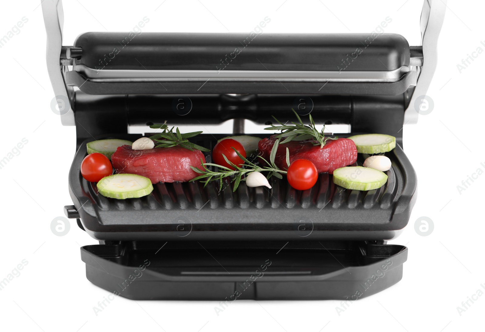 Photo of Electric grill with raw meat, rosemary and vegetables isolated on white