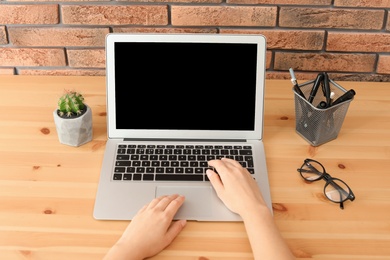 Woman working with laptop at home. Mock up with space for text