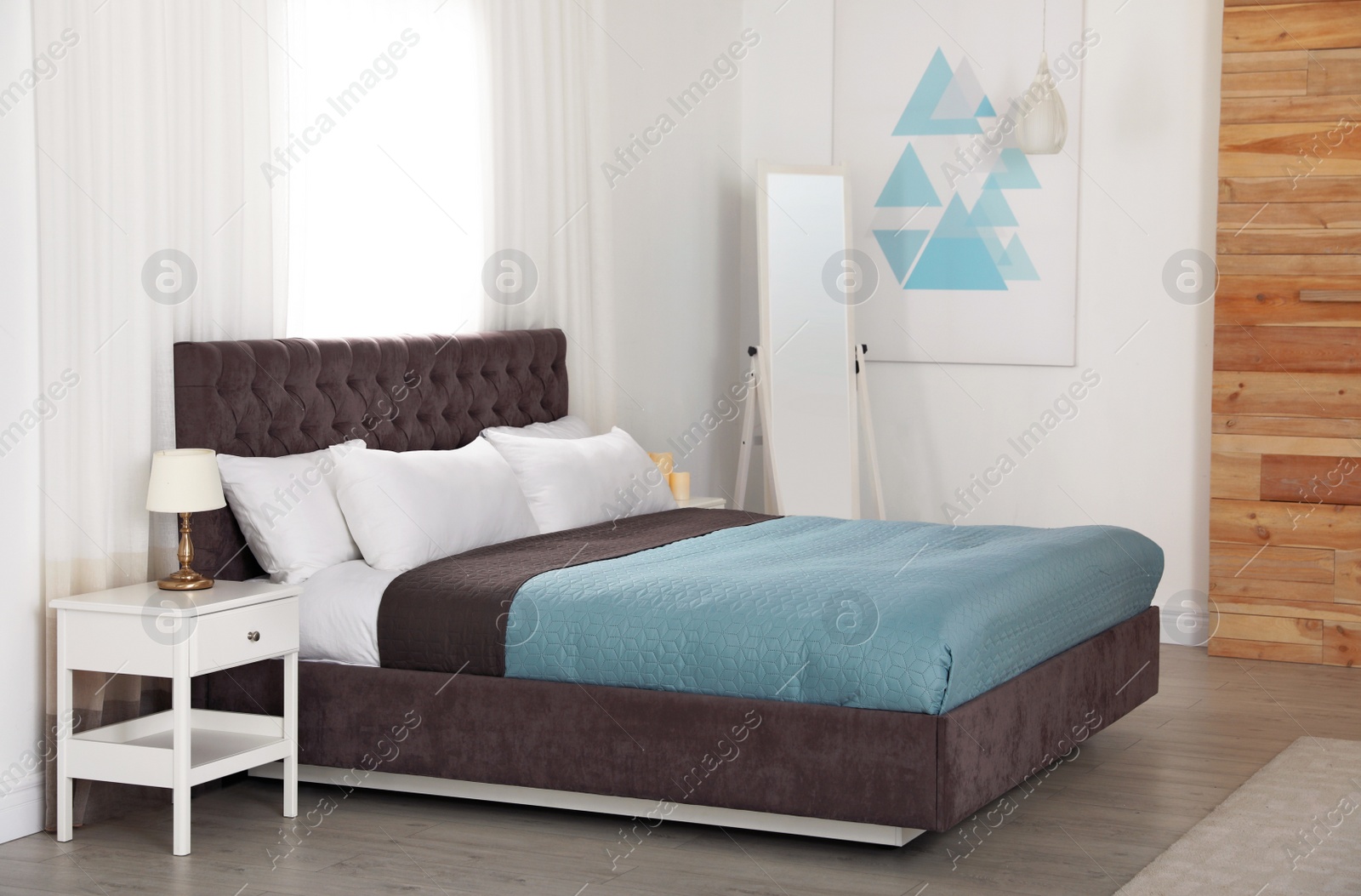 Photo of Modern comfortable bed in room. Interior design