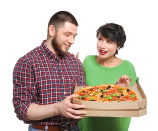 Photo of Attractive young couple with delicious pizza on white background