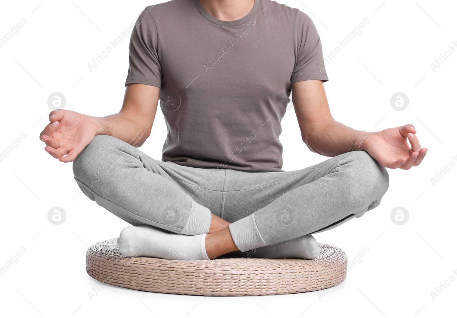 Photo of Man meditating on white background, closeup. Harmony and zen