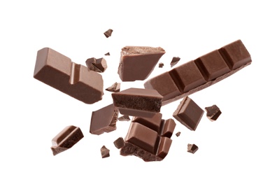 Image of Milk chocolate explosion, pieces shattering on white background